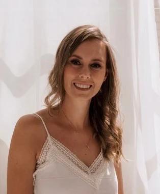 Jackie Lantzen smiling in front of a sunlit window