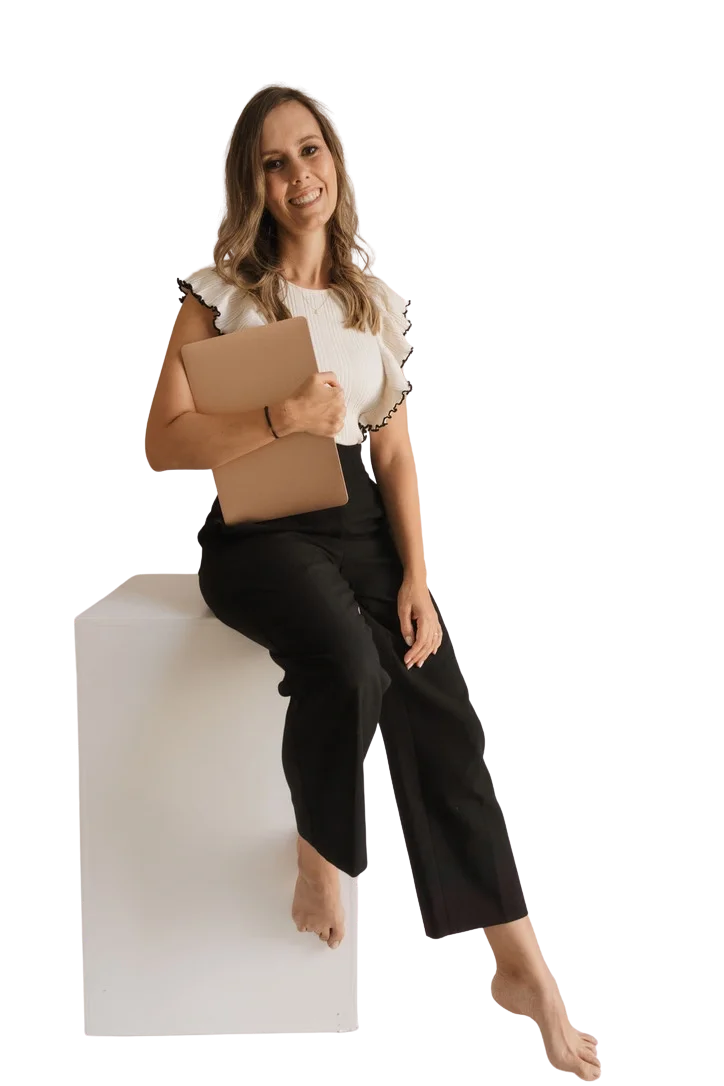 Jackie Lantzen sitting with a laptop, smiling