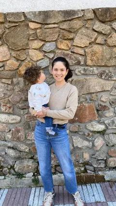Renata holding her child