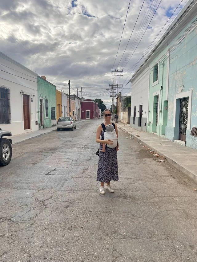 Jackie walking down a colourful street in Mexico